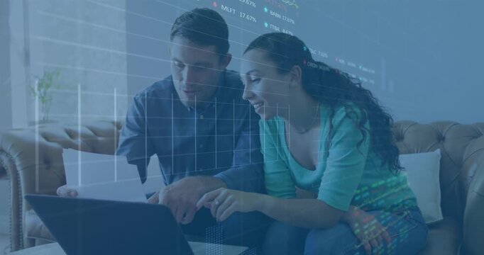 Animation of graphs, numbers, trading board over caucasian couple discussing bills at home