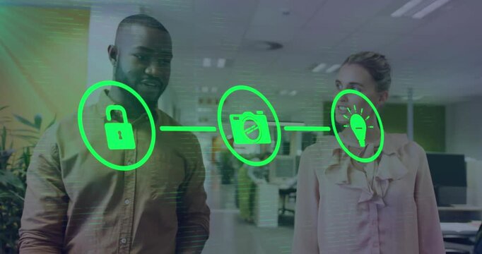 Animation of flowchart of icons over diverse coworkers discussing while walking in office