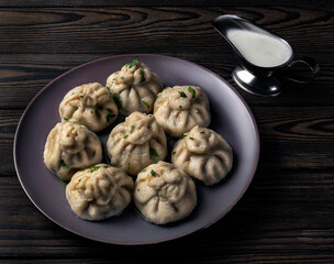 Fototapeta premium Georgian national khinkali with meat and herbs