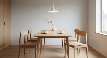 Minimalist light wood dining set featuring four matching chairs and simple tableware under a modern white pendant lamp.