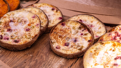 Traditional berry curd tarts on wooden board