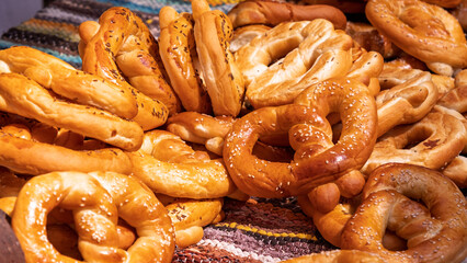 Traditional golden baked pretzels with sesame seeds