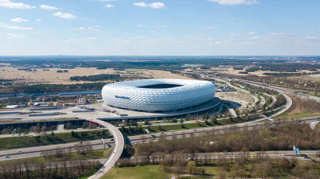 Munich, Germany - April 04, 2021: Drone flight over Football stadium Allianz Arena at sunny day