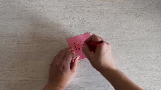 Hands Writing NO on Sticky Note with Red Marker Rejection Concept