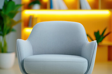 Modern armchair grey chair cozy seating home interior yellow background soft fabric ambient lighting minimalist decor creates inviting focus in stylish reading corner with plant accent on shelf