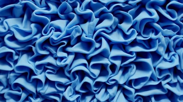 Serene blue ruffles create a calming and intricate abstract textured surface detail
