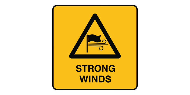 Yellow road sign warning of strong winds ahead with flag icon