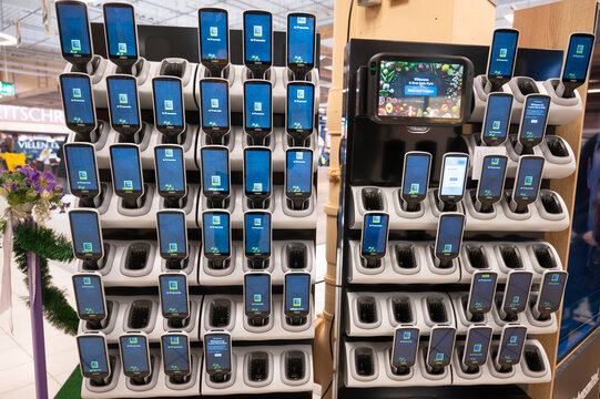 Zebra scan and go customer handheld price scanner at the entrance of a Edeka supermarket, shopping grocery with modern technology in Trier, Germany