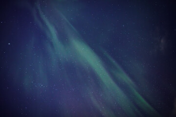 Obraz premium Aurora borealis, polar lights with Milky Way stars.