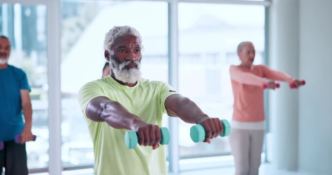 Exercise, senior man and dumbbells in class for retirement fitness, functional strength and mobility. Pensioner wellness club, elderly people and weight training in studio for joint health or workout