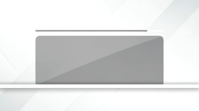 Close-up of a gray rectangular object with a thin line on top, set against a white background with subtle shadows and light gray geometric shapes.