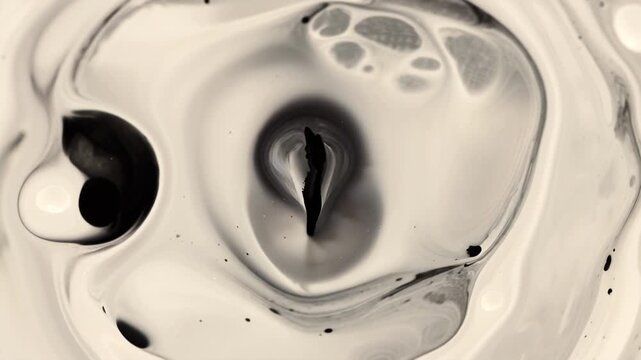 UHD 4K video, black ink glyph floating viscous cream surface, morphing continuously abstract symbols mystical shapes fluid ripples reflections, micro-droplets ink floating ambient light shadows