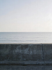Fototapeta premium empty coastal seawall in Japan with calm horizon