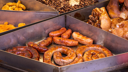 Assorted traditional grilled meats and gray peas