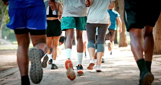 Legs, people and marathon competition in nature for fitness challenge, sport event and running. Runners, shoes of group and race contest at park for endurance test, jogging pace or cardio performance