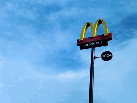Sleman, Special Regency of Yogyakarta - Indonesia - Jan 22 2026: A McDonald's fast food restaurant logo that serves drive-thru customers 24 hours a day.