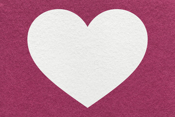 Fototapeta premium White heart on dark purple paper texture background with copy space for romantic banner, template or greeting card