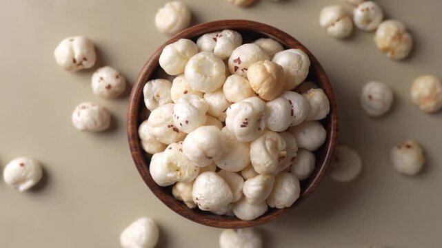 Makhana on wooden bowl closeup shot in zoomin motion.