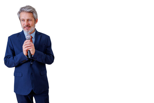 Senior businessman speaking into a microphone, delivering a corporate presentation or speech, standing on a transparent background