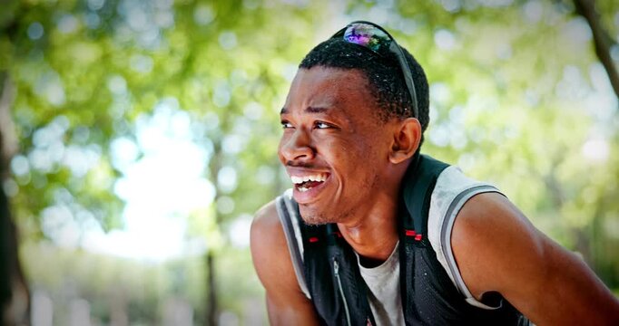 Man, tired and sweat on break for trail running in forest, breathe and exhausted in summer. Person, athlete and rest with fatigue, burnout or smile for challenge with sports competition in woods