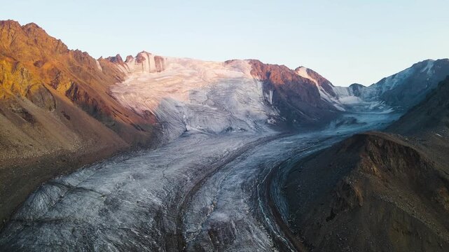 a beautiful ancient glacier. a moraine lake under the glacier. highlands