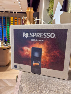 nespresso essenza mini box coffee machine packaging cardboard store interior background display of espresso pods in retail boutique shop atmosphere concept of retail, household appliances, lifestyle