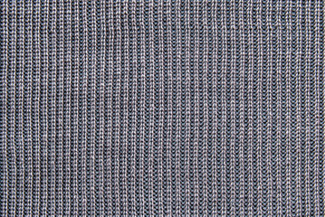 Soft gray ribbed knit fabric pattern close up as background