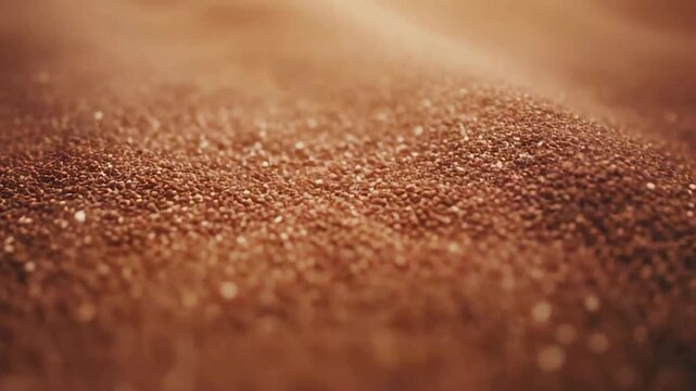 Teff grains are filling the frame, forming a textured background, representing themes of gluten free eating, healthy nutrition, organic produce, and agricultural harvest for a healthy lifestyle