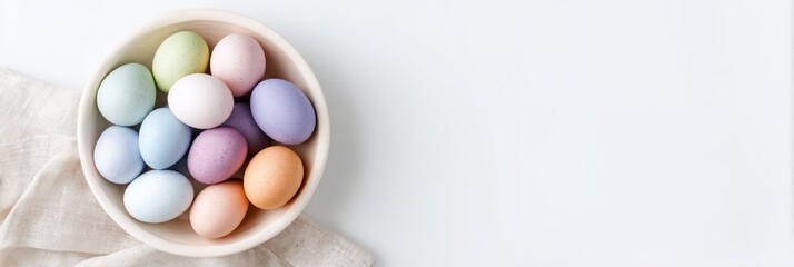 Obraz premium Bowl of colorful eggs is on a white background