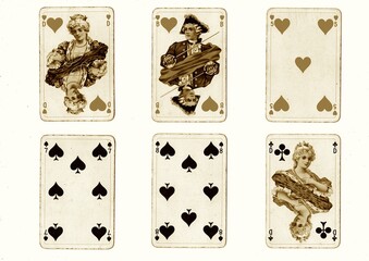A hand of vintage playing cards in sepia isolated on a white background.