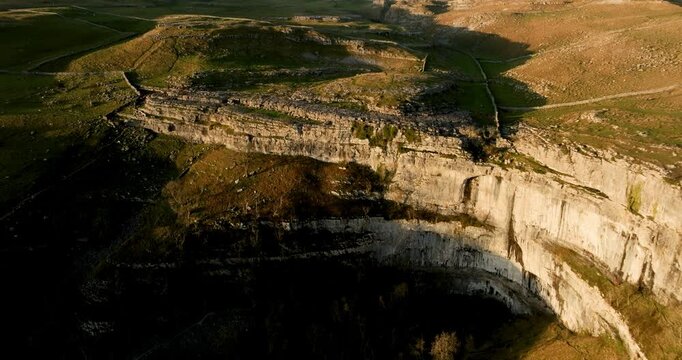 Malham cove in late afternoon light from air.