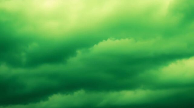Green and yellow dramatic clouds form a moody, ethereal sky textured, storm tinged atmosphere ideal as an abstract background or nature backdrop suggesting change and calm