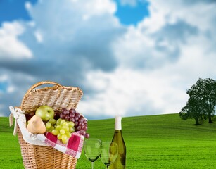 Obraz premium Beautiful cute picnic set on green grass in park