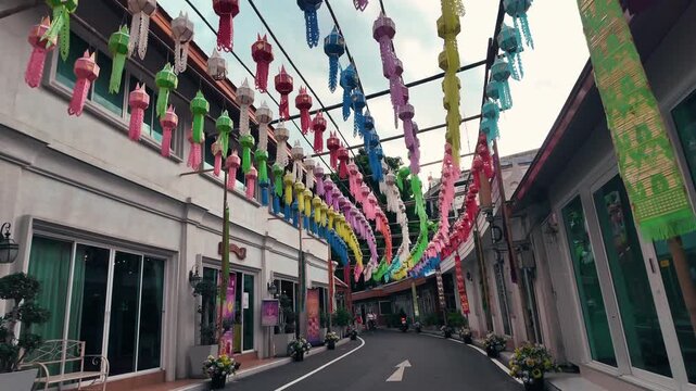 Colorful paper lanterns hanging over asian street alley, vibrant multicolor festival lanterns above narrow old town alleyway, Bangkok Thailand 4k