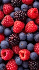 Fresh Raspberries, Blueberries and Blackberries Background Texture