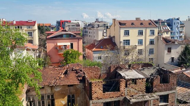 Panoramic view over a backyard in Sofia&rsquo;s Serdika district, Bulgaria, revealing a contrast of modern buildings and old brick ruins, highlighting layered urban history and architectural change