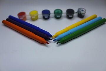 colored pencils on a white background