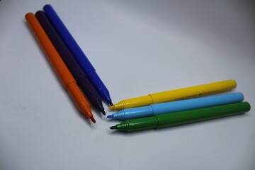 colored pencils on a paper