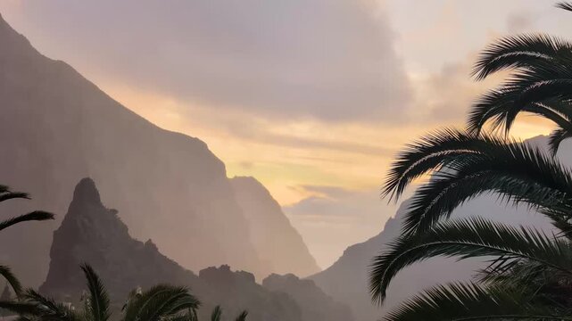 Landscape of the Masca valley in Tenerife, Canary island, Spain. Scenic mountain landscape with palm trees and tropical vegetation in Tenerife. Famous volcanic rock formation in Masca village