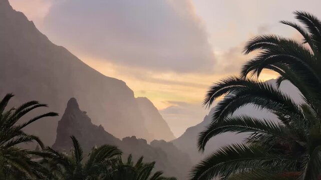 Landscape of the Masca valley in Tenerife, Canary island, Spain. Scenic mountain landscape with palm trees and tropical vegetation in Tenerife. Famous volcanic rock formation in Masca village