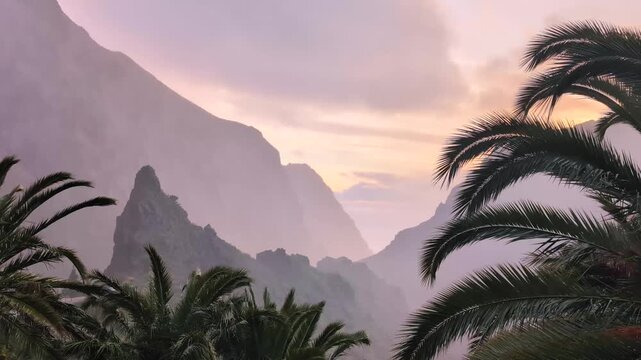 Landscape of the Masca valley in Tenerife, Canary island, Spain. Scenic mountain landscape with palm trees and tropical vegetation in Tenerife. Famous volcanic rock formation in Masca village
