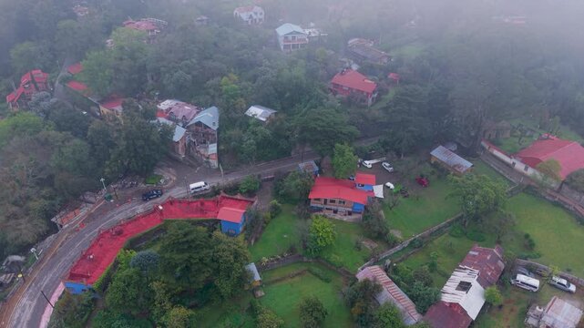 Mountain town Mineral del Chico seen from above in misty conditions