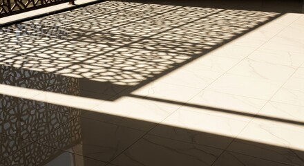 Sunlight casts intricate shadow patterns across a light colored tiled floor surface.