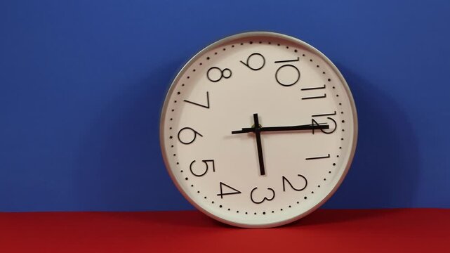 Close-up of a wall clock face rolling back and forth, with the option to copy.