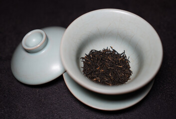 Gaiwan on the tea table selective focus. Gongfu cha tea ceremony. Chinese ceramics of Zhu Yao....
