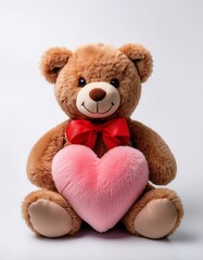 Obraz premium Brown smiling Teddy bear plush toy with red tied bow holding a pink heart shape plushie on white background 