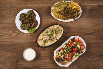 Traditional caucasian dishes on a wooden table .