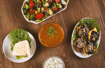 Traditional caucasian dishes on a wooden table .