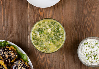 Traditional caucasian dishes on a wooden table .