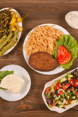 Traditional caucasian dishes on a wooden table .